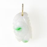 Carved jade pendant Composed of a piece of white and green jade, carved with a floral pattern and