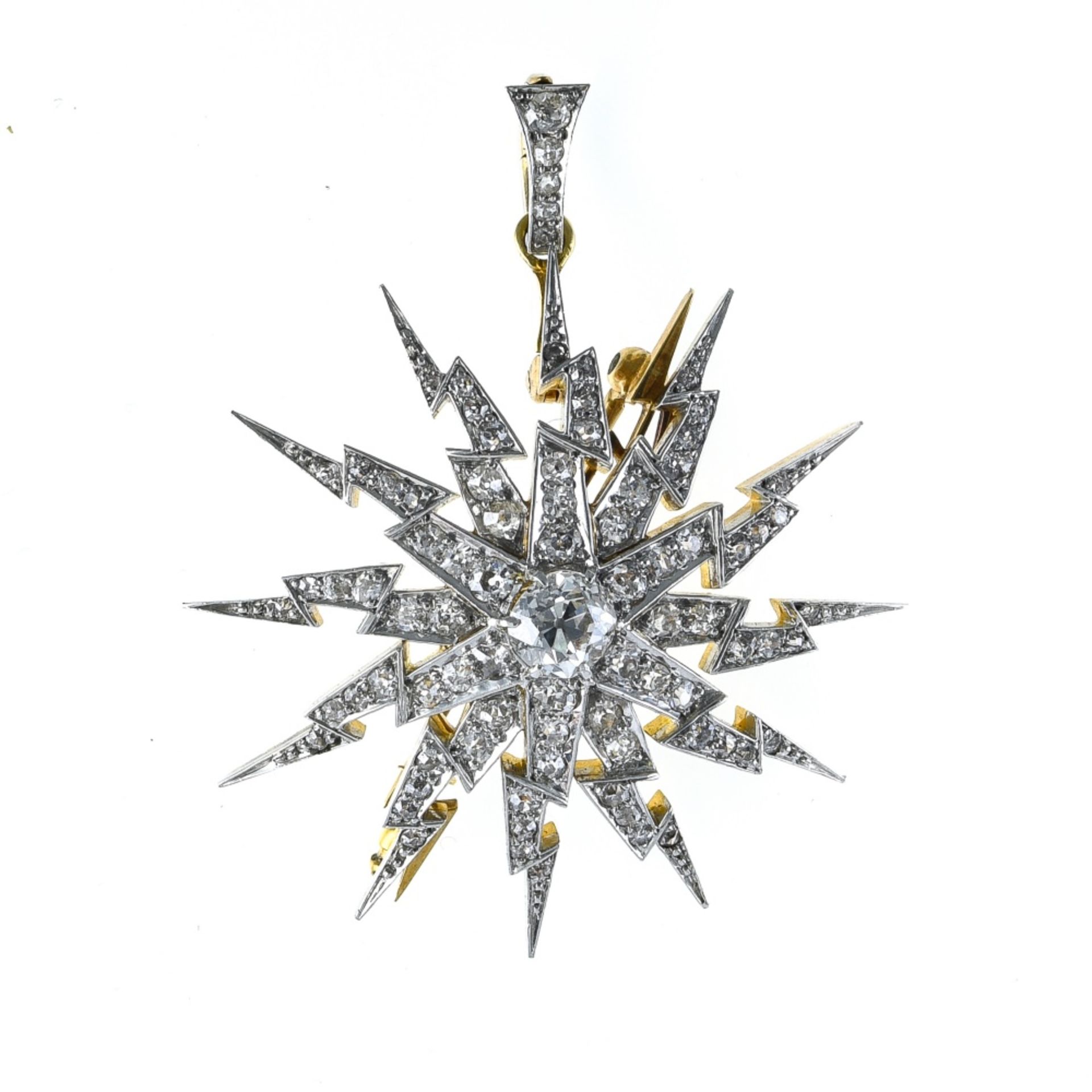 Star brooch-pendant 18 kt yellow and white gold, +/- 0.60 ct diamond. Poids (gr) : 12,9