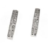Pair of diamond hoop earrings 14 kt white gold, each set with 2 rows of small brilliants.