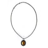 DOT Paris Modernist necklace Distressed silver, composed of an oval pendant set with a brown