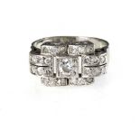 Art Deco signet ring 18 kt white gold, set with a central diamond of +/- 0.25 ct and a pavŽ setting