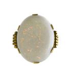 Art Deco opal ring 18 kt yellow gold, set with a large, white, oval opal (+/- 25 x 20 mm). Travail