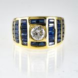 Ring 18 kt yellow gold, diamond (+/- 0.40 ct pitted), calibrated sapphires. Poids (gr) : 9,9