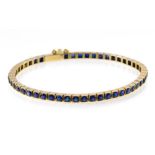 Sapphire "tennis" bracelet 18 kt rose gold, set with 52 blue sapphires (+/- 7 ct). safety chain.