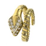 Snake ring 18 kt yellow and white gold, extendable chain links, depicting a snake whose head is set