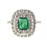 Emerald ring 18 kt white gold, set with a +/- 0.45 ct emerald surrounded by 2 rows of brilliants