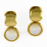 Pair of mother-of-pearl earrings 18 kt yellow gold, each adorned with a round pearl, and set with a