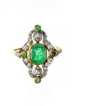 Art Deco ring 18 kt yellow and white gold ring, set with an oval emerald in the centre, surrounded