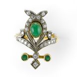 Art Nouveau ring 18 kt yellow and white gold, set with an emerald cabochon, 2 small emeralds, and