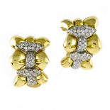 Pair of clip earrings 18 kt yellow gold, set with a pavŽ setting of small brilliants.. Contemporary