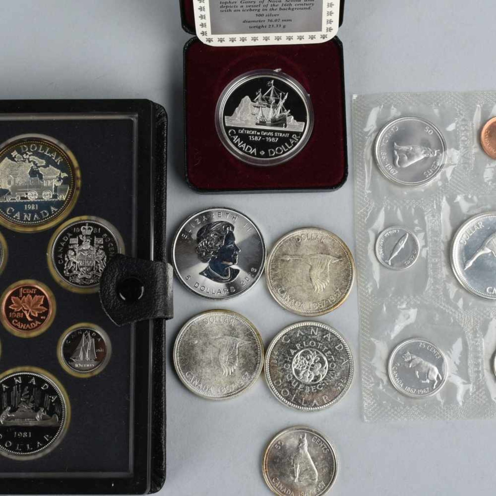 Konvolut Münzen Kanada insg. 19 Stück, dabei auch Silbermünzen, u.a.: 1 x offizielles Münzset der