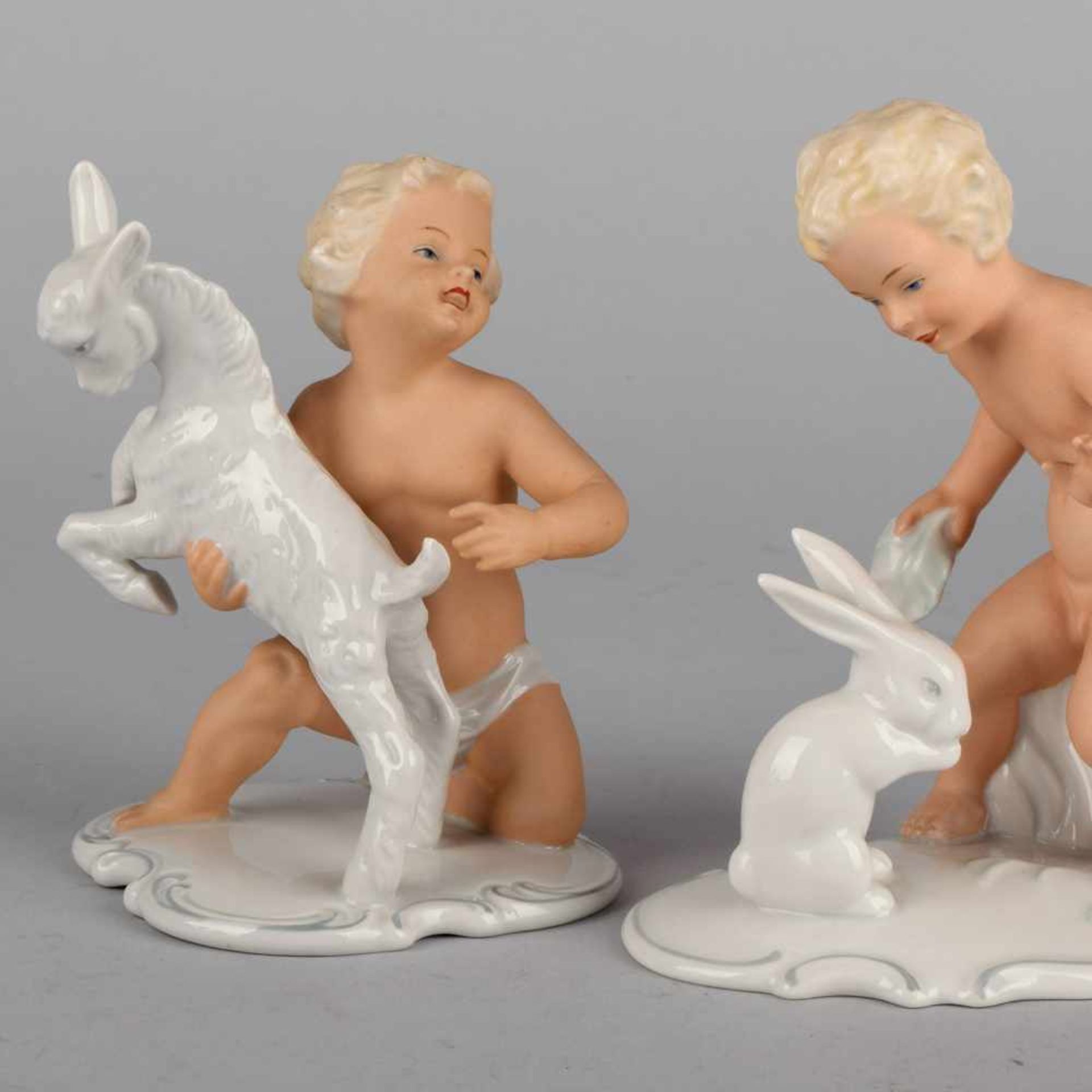 Paar Puttenfiguren Hersteller: Schaubachkunst Unterweißbach, Putto mit Ziege und Putto mit Hasen,