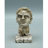 A lovely Gandharan stucco head from the Indus Valley, ca. 4th - 5th Century AD. This superbly