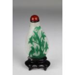 Chinese, Late 18th C. Green Overlay Glass Snuff Bottle. Of flattened pear form; "snow flake" white