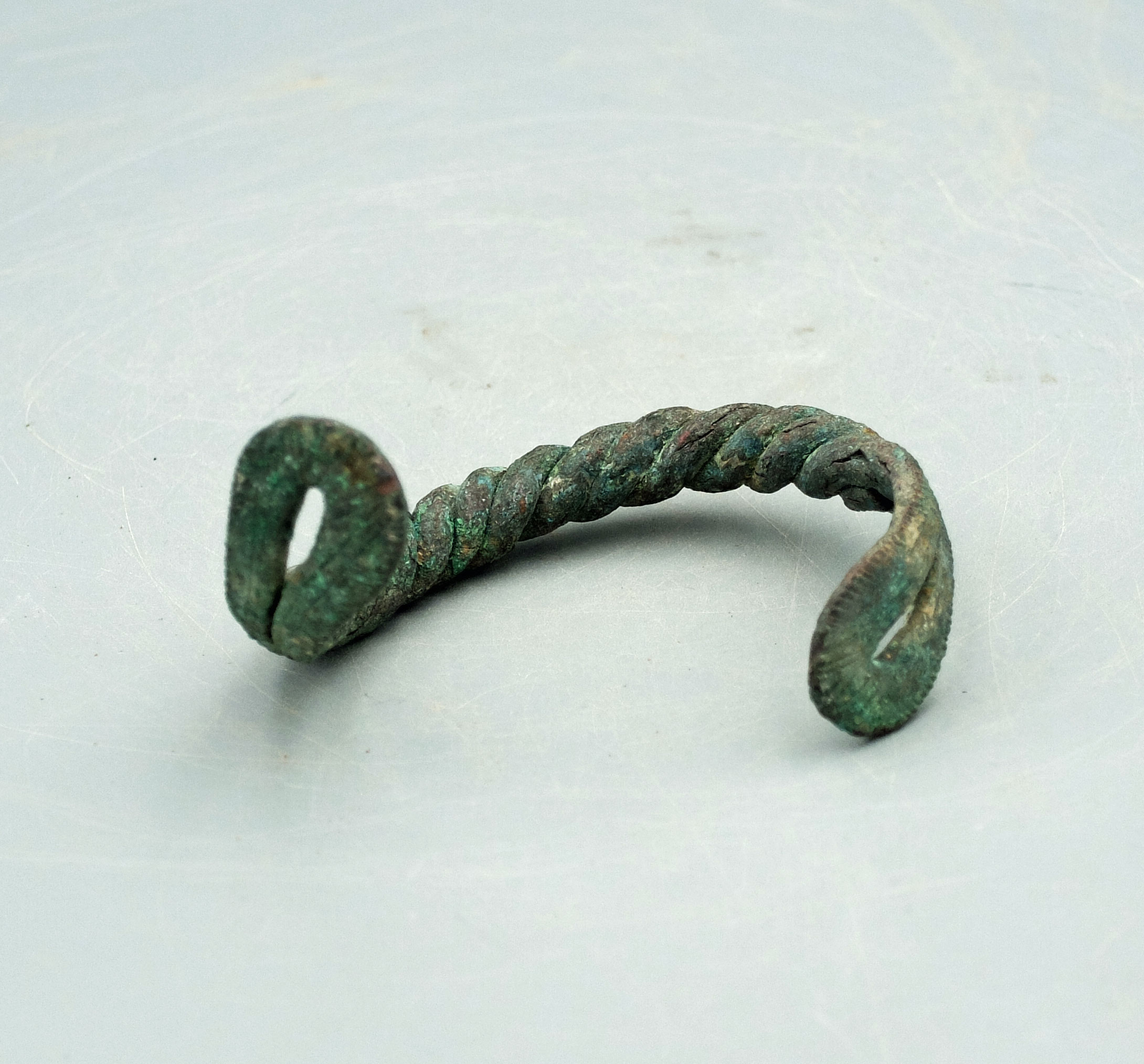 A lovely bronze bracelet from Luristan, ca. 800 - 200 BC. This beautiful braided example is 3 inches