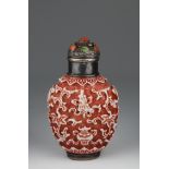 Chinese Qianlong Period Porcelain Snuff Bottle. Molded with a design of the Eight Buddhist