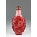 18/19th C. Overlaid 'Snowflake' Glass Snuff Bottle. A red overlaid 'snowflake' glass snuff bottle.