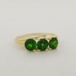 10K Gold & 3-Stone Emerald Ring. Stamped '10K' inside band. Total Weight: 1.4 dwt / 2.2 g Ring Size: