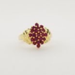 10K Gold & Ruby Cluster Ring. Stamped '10K' inside ring. Total Weight: 3 dwt / 4.7 g Ring Size: