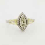 14K White Gold Marquise Diamond Ring. Center stone surround by ring of round cut diamond and band