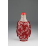 Fine Red Overlay 'Snowflake' Glass Snuff Bottle. 18th/19th century. Carved through the cranberry-red