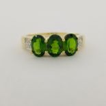 10K Gold & 3-Stone Emerald Ring. Stamped '10K' inside band. Total Weight: 1.9 dwt / 2.9 g Ring Size: