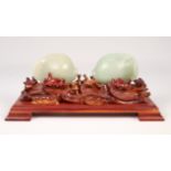 Pair of Jade Fish on Wooden Stand