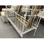 19th cent. Painted cast iron child's cot that converts to a bed. 50ins. x 29ins. x43ins.