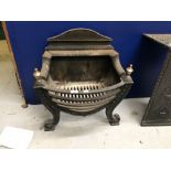 19th cent. Cast iron fire basket in neo classical style.