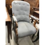 19th cent. Mahogany library chair on turned supports and cup castors.