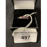 Hallmarked Jewellery: 9ct. Ring half hoop set with three rubies and two eight cut diamonds.