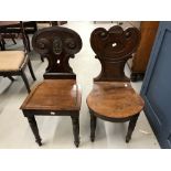 19th cent. Mahogany hall chair with inset oval armorial to the back, plus one other.