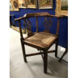 Early 19th cent. Oak corner chair with rattan seat and pierced splats.