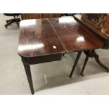 19th cent. Mahogany tea table on tapering supports.