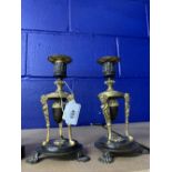 19th cent. French Empire bronze and ormolu candlesticks, circular bases with paw feet, supporting