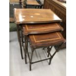 20th cent. Mahogany nest of three tables with oval inset inlaid decoration.