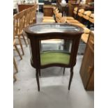 20th cent. Mahogany kidney shaped display cabinet with bevelled glass top.