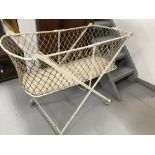 19th cent. Painted metal crib with knotted network sides. On stand. 42ins. x 19½ins. x 32½ins.