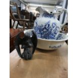 20th cent. Blue and white jug and bowl set, plus a cast angel.