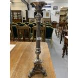 19th/20th cent. Plated torchere, central column, support by tripod base with lion paws and depicting