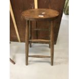 19th cent. Elm high stool on spindle supports. Height 27ins.