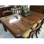 19th cent. Mahogany dining table with two leaves on turned supports with winder. Extended 72ins. x