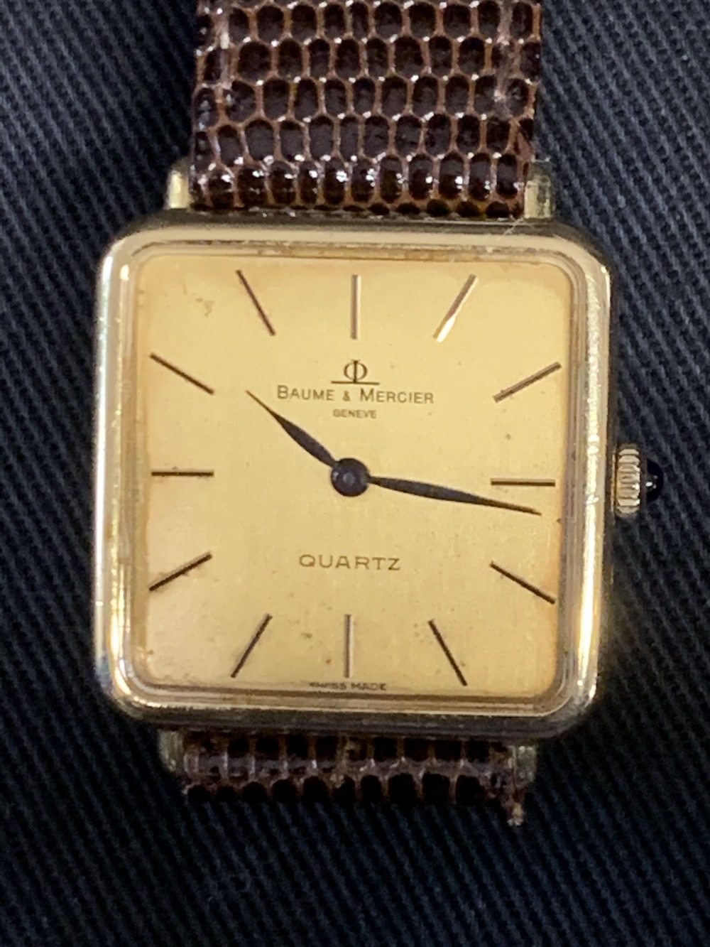 Watches: 18ct. gold Baume and Mercier quartz watch on brown lizard skin strap.