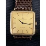 Watches: 18ct. gold Baume and Mercier quartz watch on brown lizard skin strap.