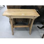 20th cent. Oak organ stool with sloping seat and trussed supports. 26ins. x 10½ins. x 23½ins.