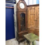 Clocks: Late 19th/early 20th cent. German oak three chain longcase clock. 11ins silvered dial with