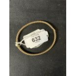 Hallmarked Jewellery: 9ct. gold entwined curb link bangle, hallmarked Birmingham. 13.8g.