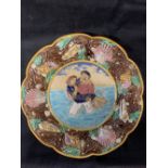 Ceramics: George Jones Majolica Biaritz plate, moulded with a couple wearing swimming costumes.