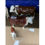 Beswick Cattle: Polled Hereford bull, cow and calf.