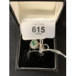 Hallmarked Jewellery: 9ct gold ring set with an oval emerald, estimated weight 0.30ct, surrounded by